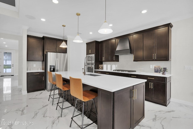 kitchen featuring stainless steel appliances, an island with sink, a kitchen bar, decorative light fixtures, and custom exhaust hood