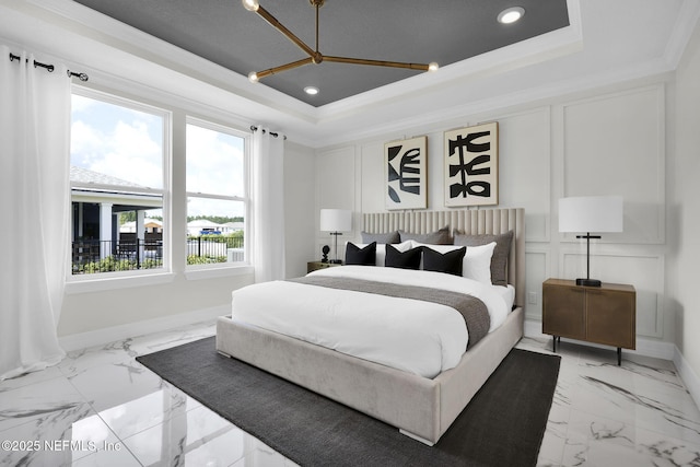 bedroom with crown molding and a raised ceiling