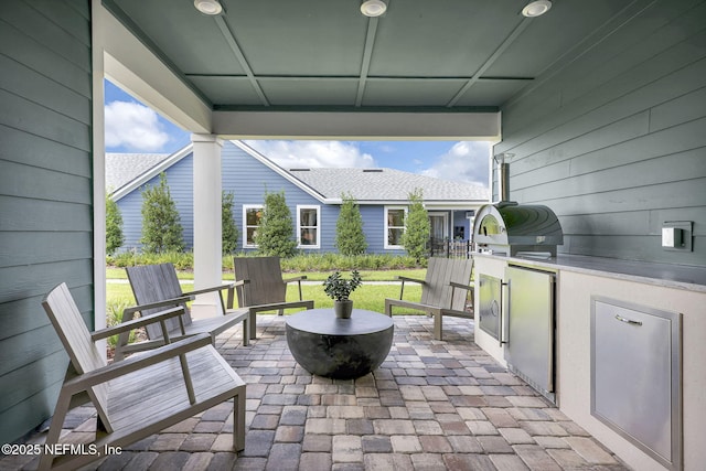 view of patio with an outdoor kitchen