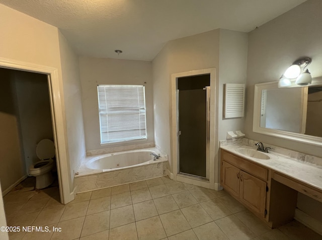 full bathroom featuring tile patterned floors, toilet, a textured ceiling, vanity, and independent shower and bath