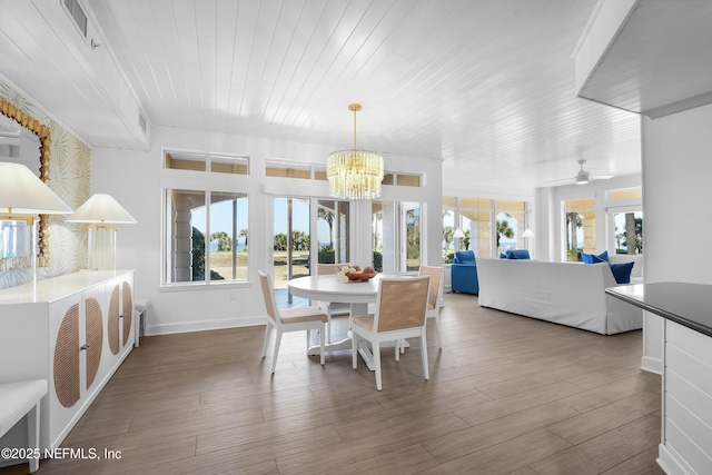 dining room with wood ceiling, ceiling fan with notable chandelier, and hardwood / wood-style floors