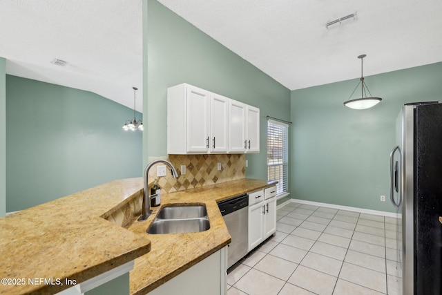 kitchen with stainless steel appliances, white cabinetry, sink, and decorative light fixtures