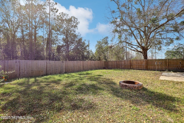 view of yard with an outdoor fire pit