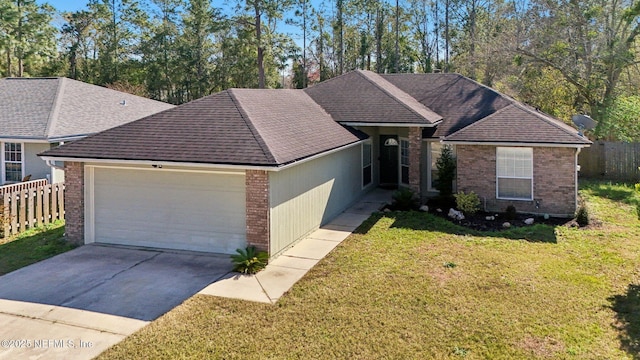 view of front of house with a garage and a front yard