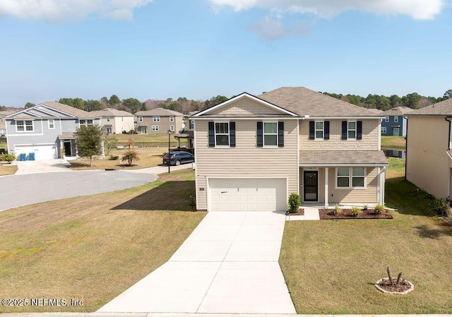 view of front of house with a garage and a front yard