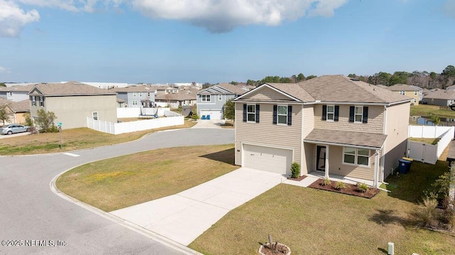 view of front of property with a garage and a front yard