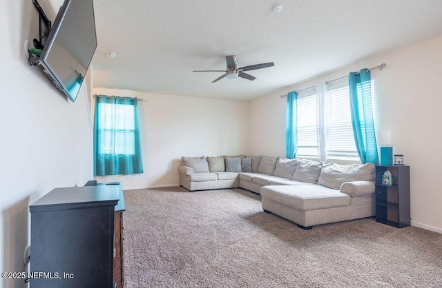 living room featuring ceiling fan and carpet