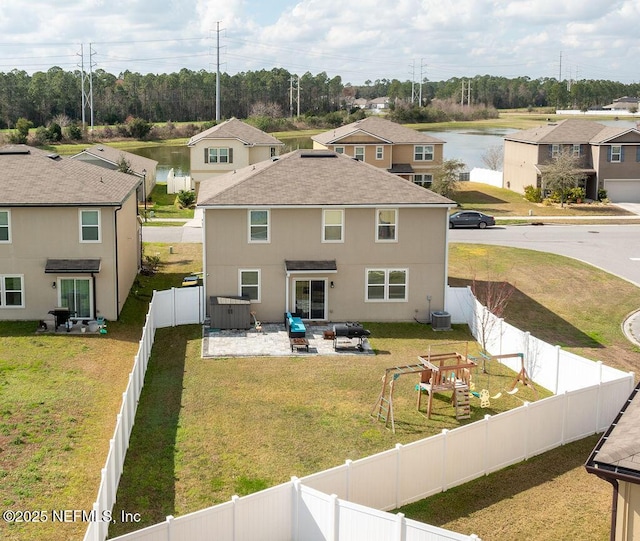 exterior space with a patio area, central air condition unit, a yard, an outdoor living space, and a playground