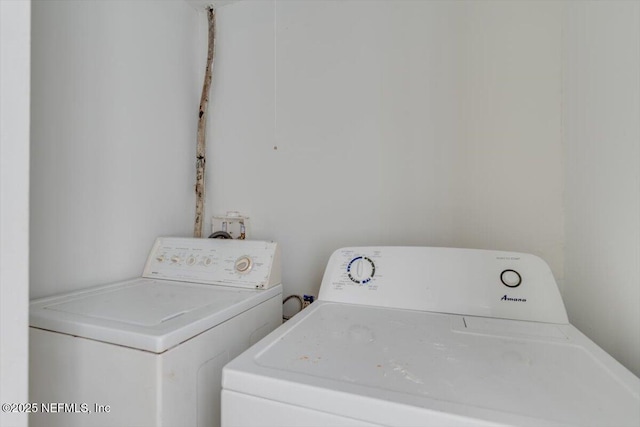 washroom with washer and dryer