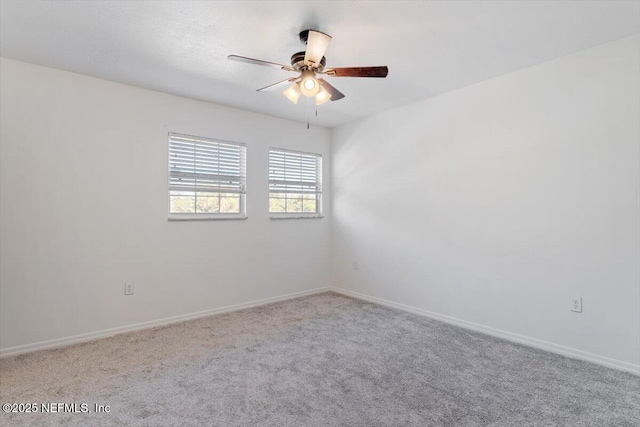 unfurnished room with ceiling fan and carpet floors