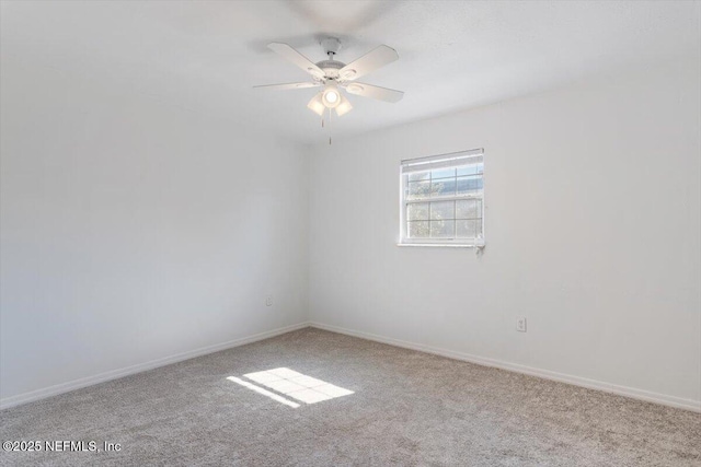 empty room with light carpet and ceiling fan