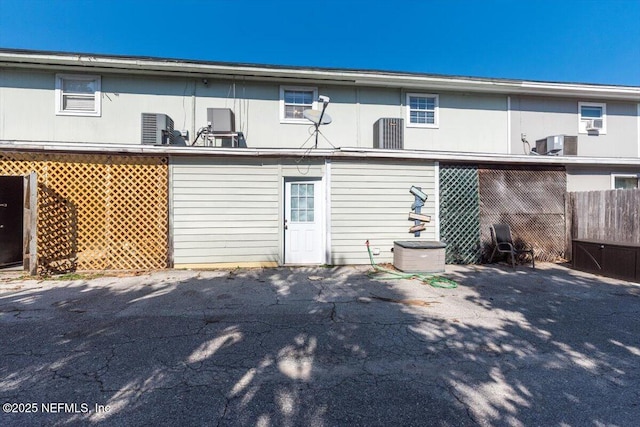 back of house featuring cooling unit and a patio area