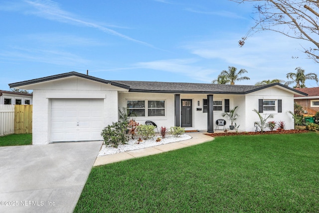 ranch-style home featuring a garage and a front lawn