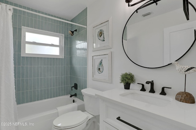 full bathroom with vanity, shower / bath combination with curtain, and toilet