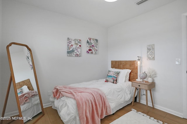 bedroom with light hardwood / wood-style floors