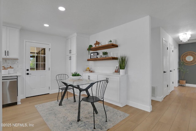 dining space featuring light hardwood / wood-style flooring