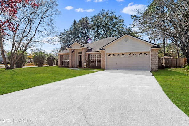 single story home with a garage and a front lawn