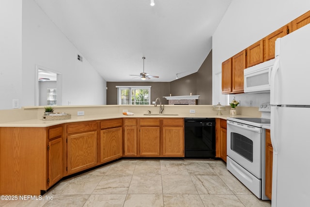 kitchen with lofted ceiling, sink, ceiling fan, kitchen peninsula, and white appliances