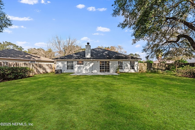 rear view of property with a patio, a lawn, and central air condition unit