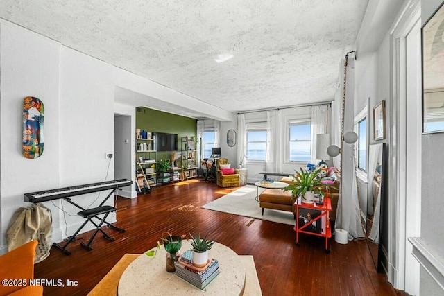 living room featuring hardwood / wood-style flooring and a textured ceiling