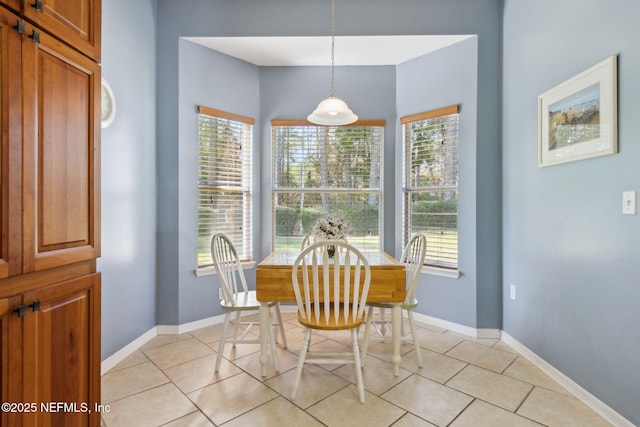 dining room with light tile patterned flooring