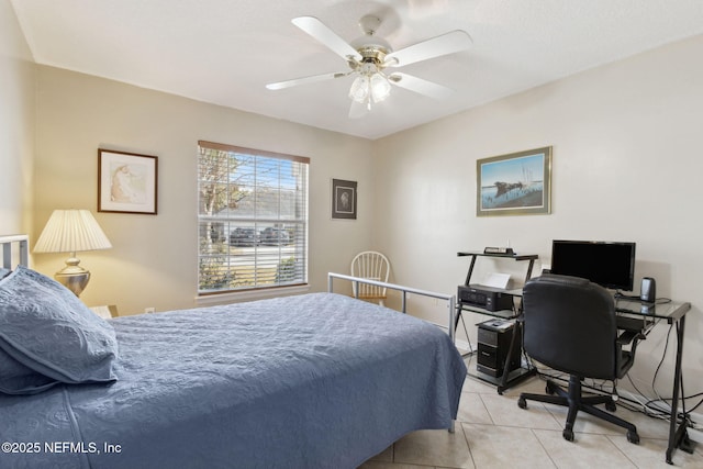 bedroom with ceiling fan and light tile patterned floors