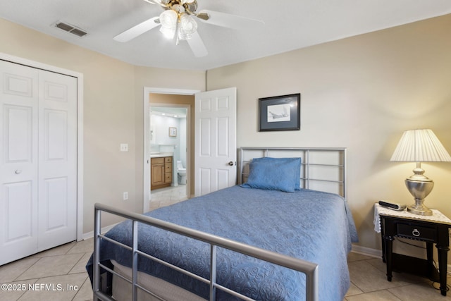 bedroom with light tile patterned floors, a closet, and ceiling fan