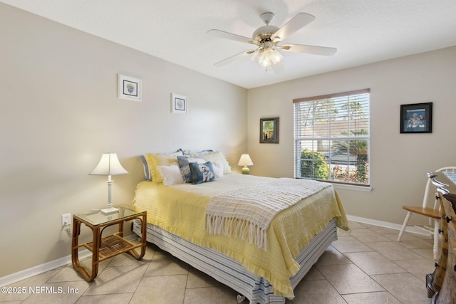 tiled bedroom featuring ceiling fan