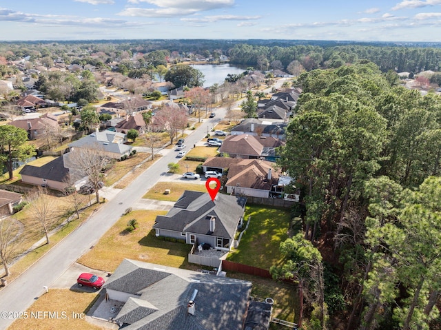 bird's eye view with a water view