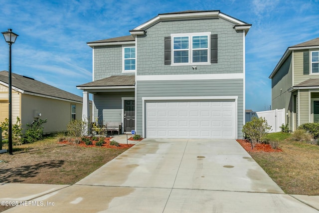 view of front property with a garage and a front yard