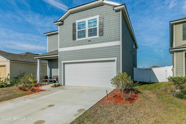 view of front of house with a garage and a front yard