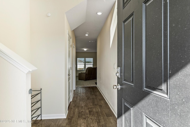 hallway with dark hardwood / wood-style floors