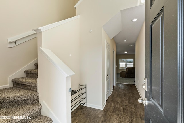 stairs featuring wood-type flooring