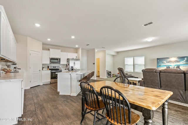 dining room featuring dark wood-type flooring