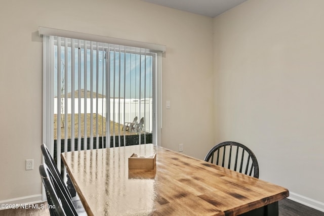 dining room featuring a water view