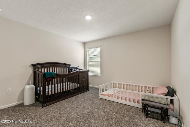 bedroom with carpet and a textured ceiling