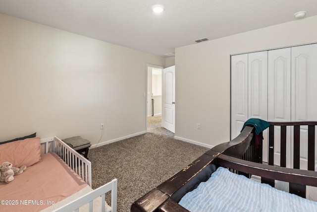 carpeted bedroom featuring a closet