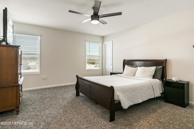 carpeted bedroom featuring multiple windows, ceiling fan, and a textured ceiling