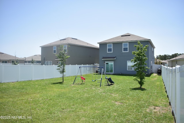 2271 Willow Glen Ln, Green Cove Springs, FL 32043 - back of house with stucco siding and a playground