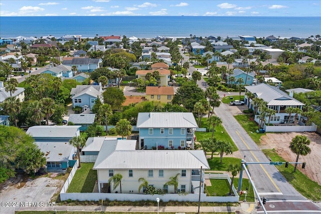 birds eye view of property with a water view and a residential view