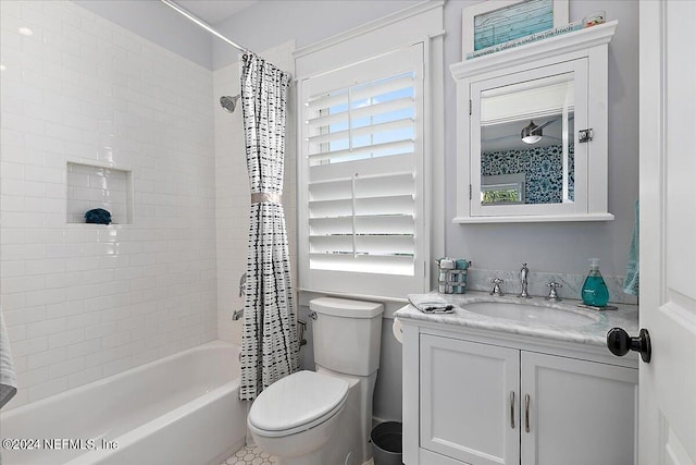 bathroom with toilet, shower / tub combo, and vanity