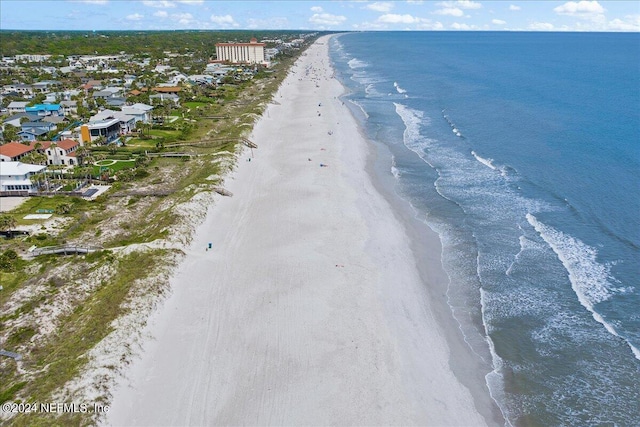 bird's eye view with a water view and a view of the beach