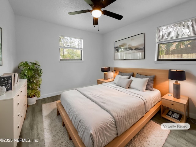 bedroom featuring wood-type flooring and ceiling fan