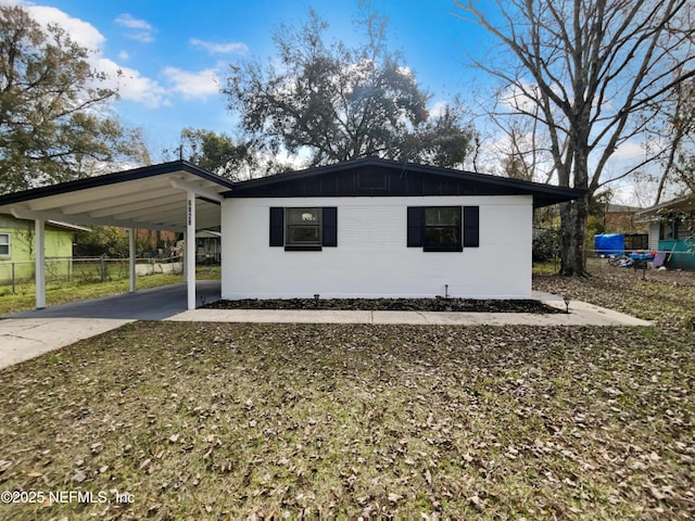 view of side of home featuring a carport