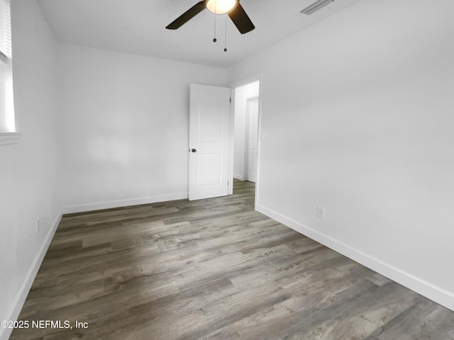 empty room with wood-type flooring and ceiling fan