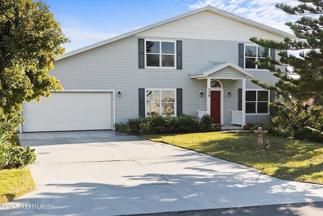 view of front of home featuring a garage and a front lawn