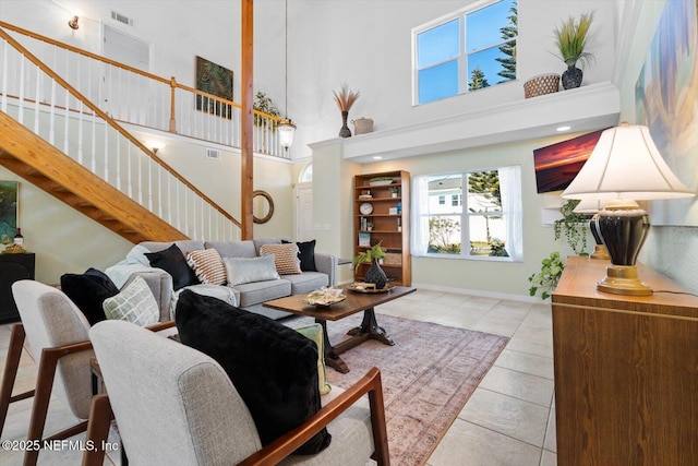 living room featuring a towering ceiling