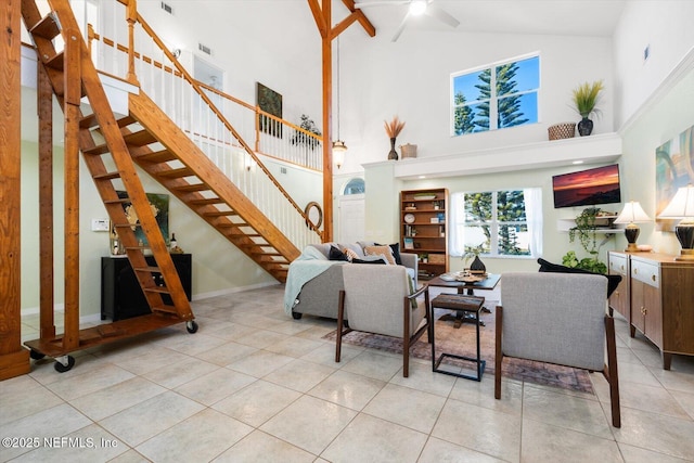 tiled living room with a towering ceiling