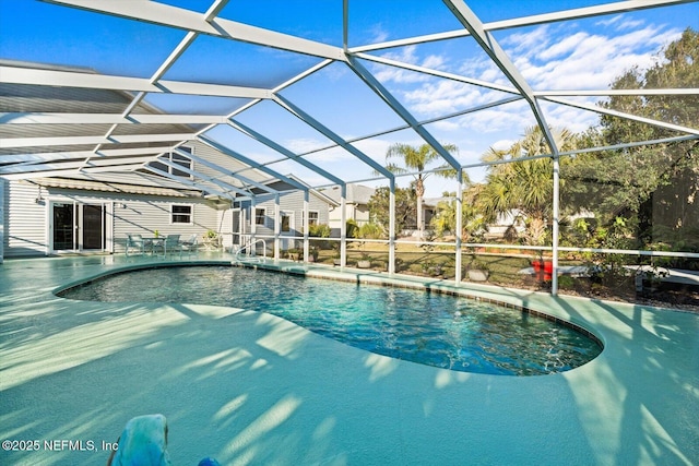 view of pool with a lanai and a patio area