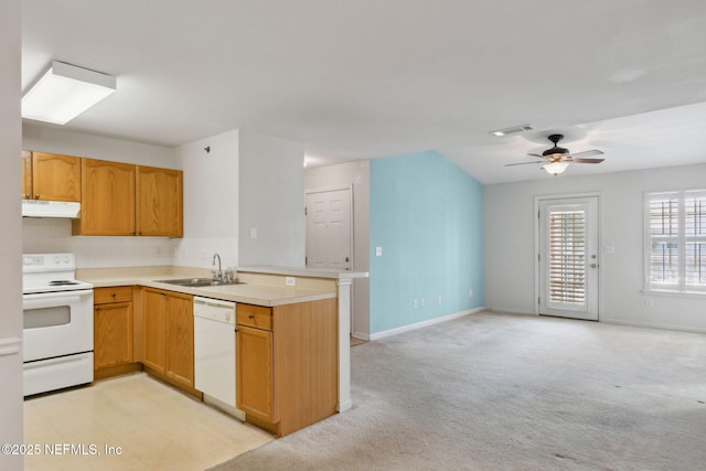 kitchen featuring sink, light colored carpet, ceiling fan, kitchen peninsula, and white appliances